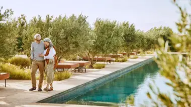 couple walking by pool