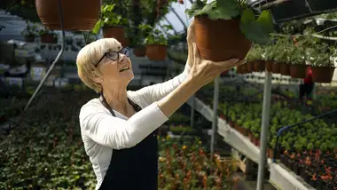 Woman gardening with potted plant