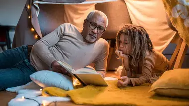 Grandpa and grandchild reading together