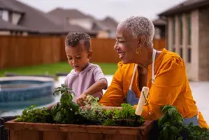 Grandmother and grandson gardening